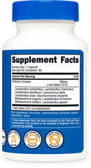 Nutricost Probiotic Complex bottle beside packaging and glass of water