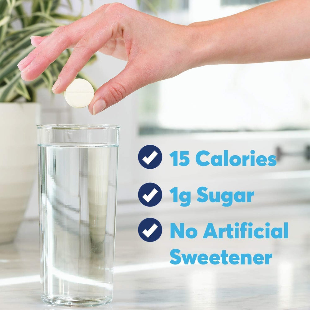 Tall glass of water with Nuun Active Strawberry Lemonade being prepared