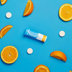 Close-up Nuun Bev Tube Orange tablet showing texture for quick hydration.