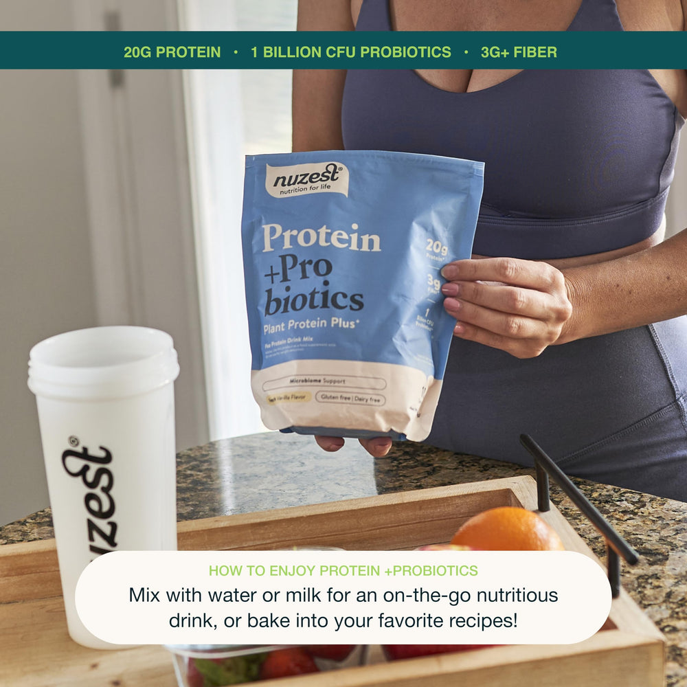 Lifestyle shot: glass of shake and scoop with Nuzest packaging