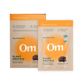 Front view of OM Mushroom Superfood Master Blend vegan protein powder chocolate single-serve packet