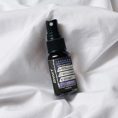 Bottle beside a glass of water