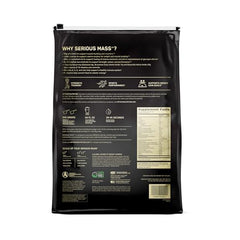 Optimum Nutrition Serious Mass strawberry powder being scooped for calorie-dense shakes.