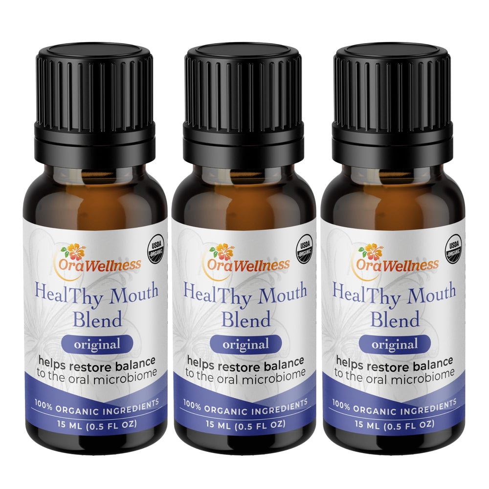 Three OraWellness Healthy Mouth Blend Tooth Oil bottles in a row