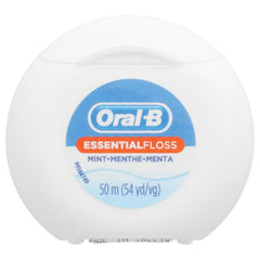 Waxed dental floss being pulled to show shred-resistant coating