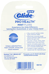 Close-up of Oral-B Glide Floss Mint 54.6 Yard being unspooled
