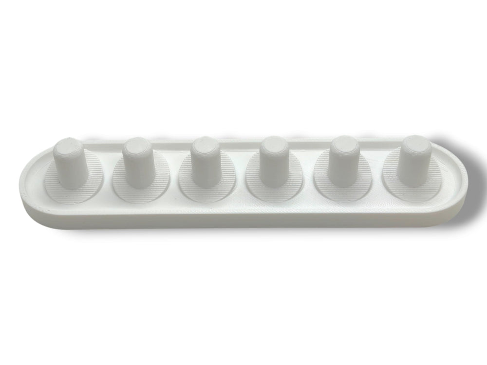 Side view of the Oral-B iO head holder's compact design