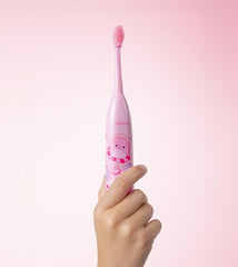 Child brushing teeth with ORDO Squishmallows toothbrush