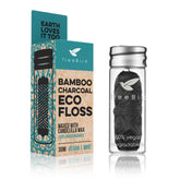 Organic bamboo charcoal dental floss with mint flavor in a refillable glass holder