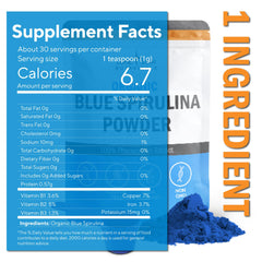 Scooping blue spirulina powder with a spoon