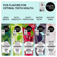 Organic Shop toothpaste on toothbrush demonstrating gentle everyday brushing