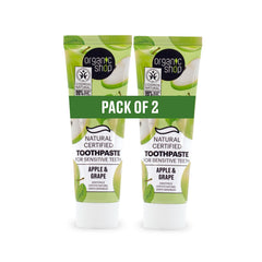 Organic Shop front packaging showing two toothpaste tubes and fresh apples