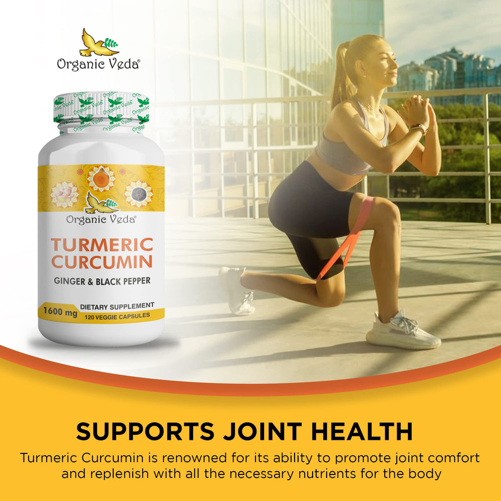 Close-up of orange capsules in hand