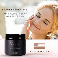 Studio shot of Osmosis supplement bottle with glass of water