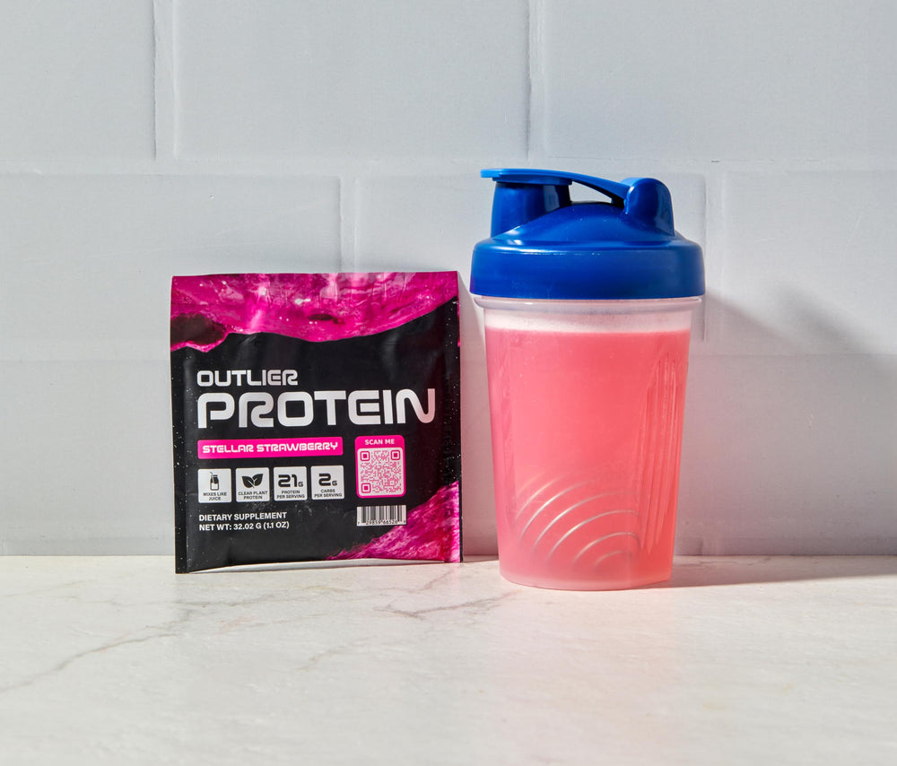 Outlier Protein clear strawberry scoop showing easy-to-mix plant protein on the go