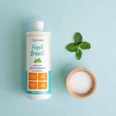 Alcohol-free mouthwash bottle with mint leaves