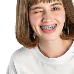 Package contents displayed: braces ligatures storage box and mirror.