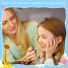 Close up of nylon floss and giraffe shaped toddler floss pick