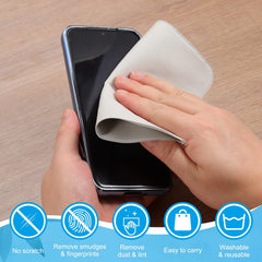 Cleaning cloth being used to wipe a camera lens
