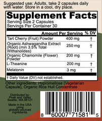 Two Peak + Valley sleep aid capsules with a glass of water