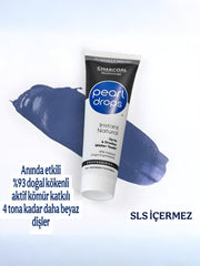 Close-up of toothpaste texture with charcoal particles