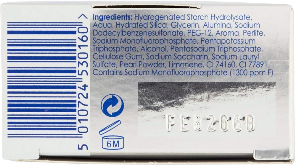 Brushing teeth with Pearl Drops whitening toothpaste for a bright smile