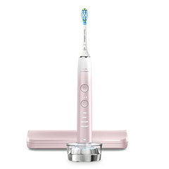 Box contents including toothbrush, brush head, glass charger, travel case and charger base