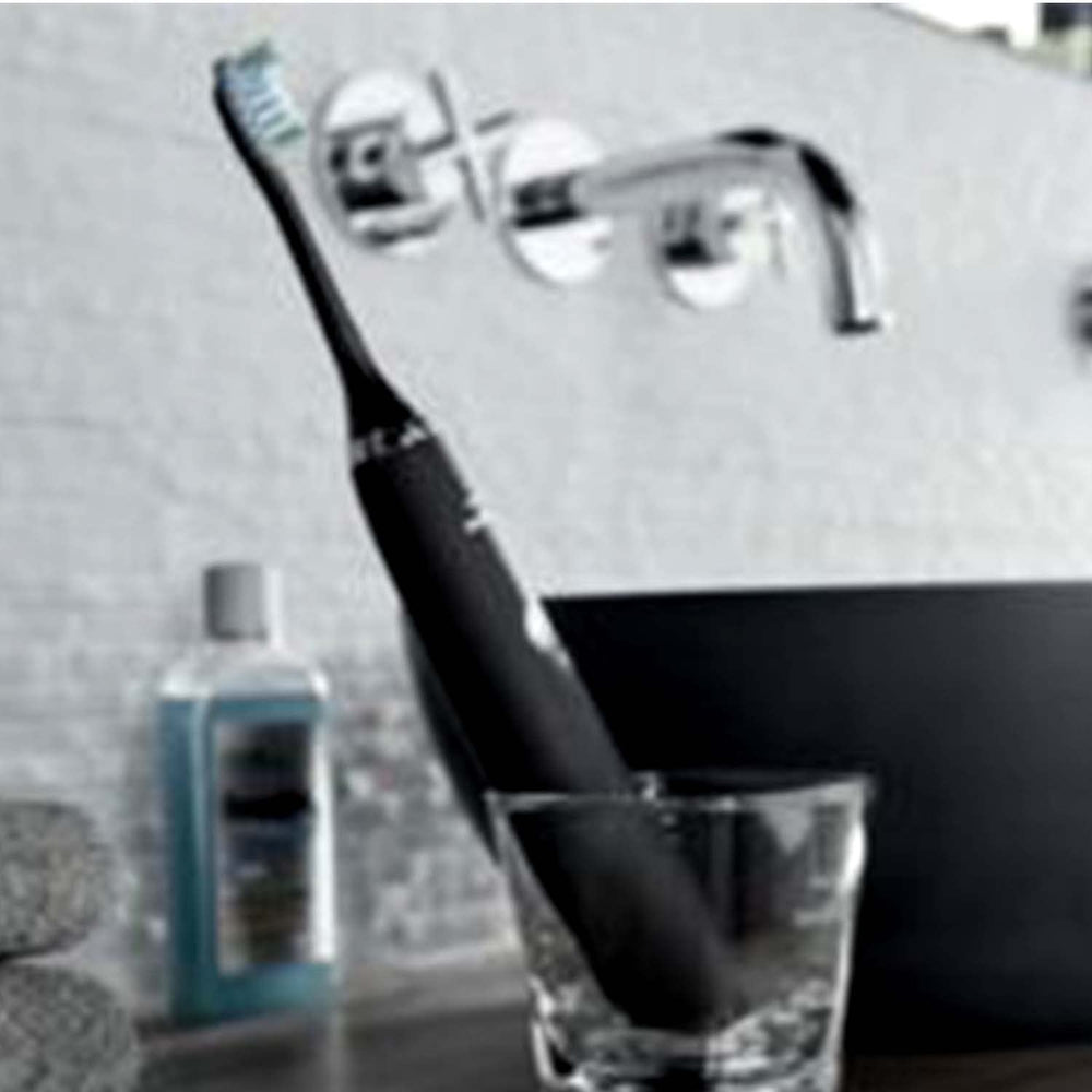 Close-up of Philips Sonicare Premium Gum Care brush head showing curved bristles and microchip