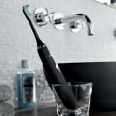 Close-up of Philips Sonicare Premium Gum Care brush head showing curved bristles and microchip