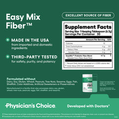 Measuring 1 tablespoon of Easy Mix Fiber for use in a drink
