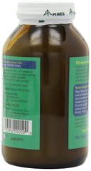 Pines Wheat Grass Powder dispensed into a glass shows vibrant green color