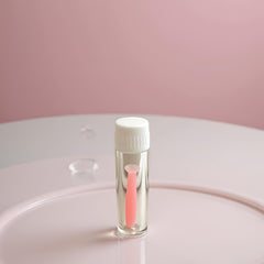 Travel-friendly pink case with insertion tool and lens storage
