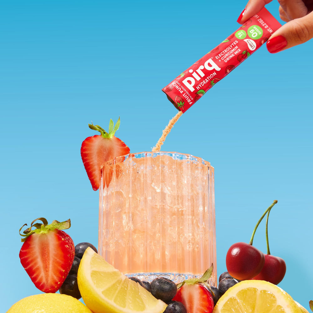 Pirq Hydration Fruit Punch in-motion bottle pour highlights fast, tasty hydration on workouts.