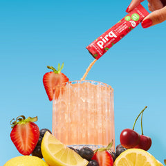 Pirq Hydration Fruit Punch in-motion bottle pour highlights fast, tasty hydration on workouts.