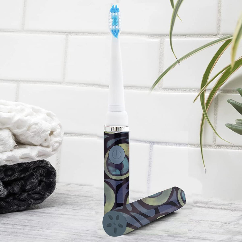 7-inch tall travel toothbrush powered by AAA battery with cap