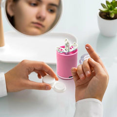 Waterproof cleaning chamber with transparent lid on pink device