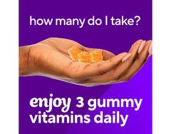 Gummies spilled on white surface with bottle