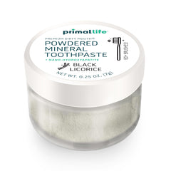 Toothbrush ready to dip into Dirty Mouth Toothpowder for brushing