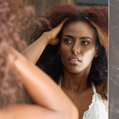 Professional-grade black castor oil bottle with dropper for DIY beauty