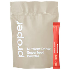 Bottle of Proper The Oranges Immune Support Supplement with scoop