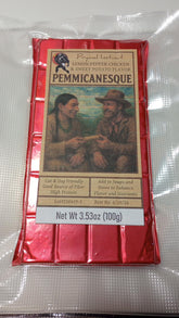 Prymal Instinct Pemmicanesque Lemon Pepper Chicken & Sweet Potato snack bar in packaging on a wooden surface