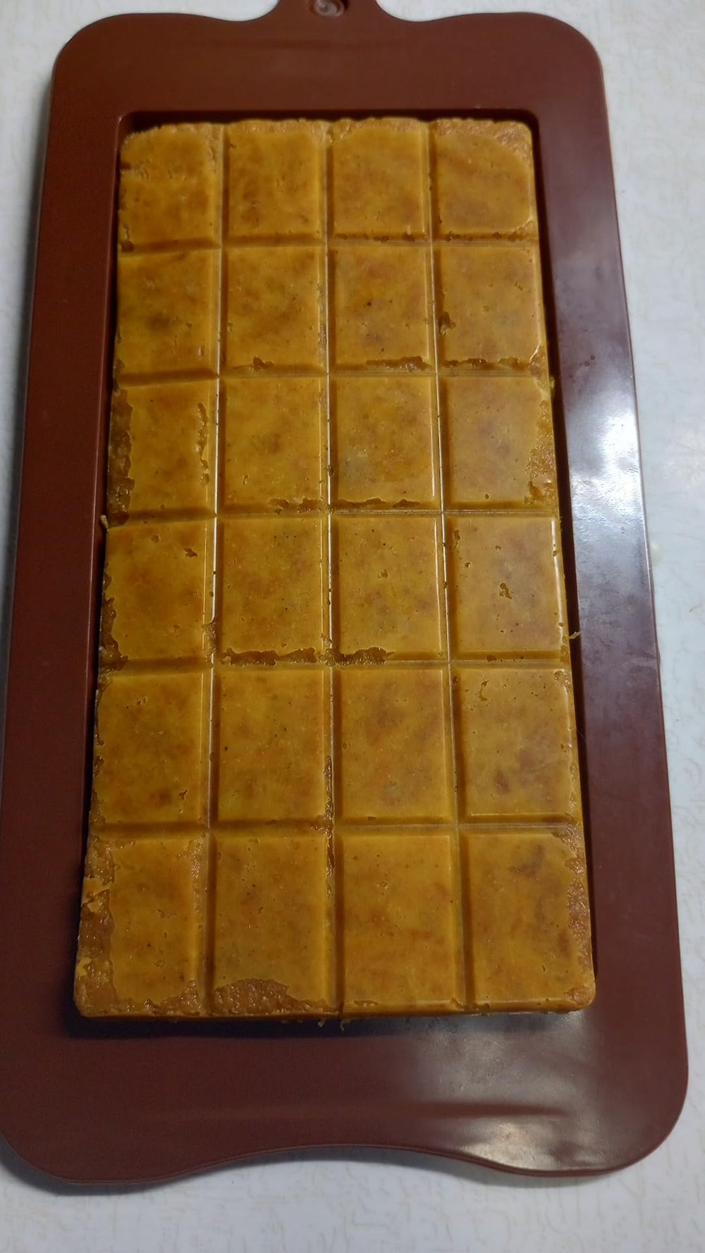 Unwrapped Prymal Instinct Pemmicanesque bar showing dense meat and tallow texture