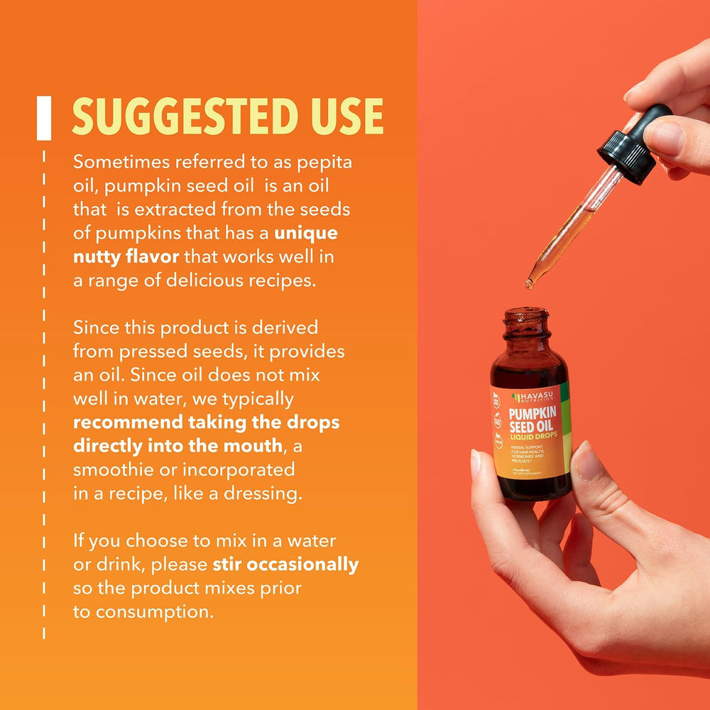 Pouring pumpkin seed oil drop from the dropper