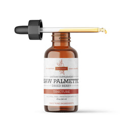 Droplets of Saw Palmetto tincture being added to a glass