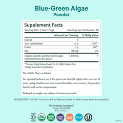 Measuring scoop of PURE SYNERGY Blue-Green Algae powder in glass