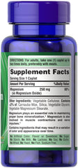 Close-up of Puritans Pride Magnesium 250 mg caplets bottle