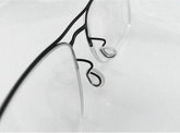 Close-up of push-in eyeglass nose pads made of soft silicone