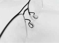 Close-up of push-in eyeglass nose pads made of soft silicone