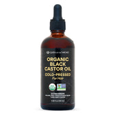 Queen of the Thrones Organic Black Castor Oil 100 mL in amber glass bottle with dropper