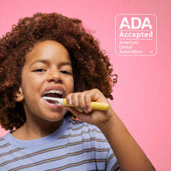 Quip kids glow pink sonic toothbrush close-up branding